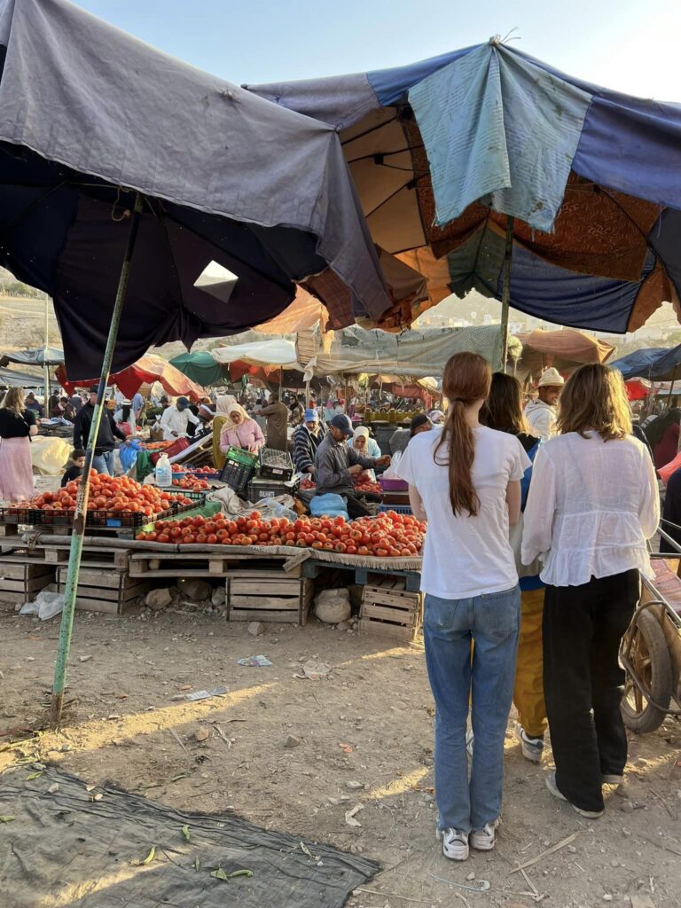 Two girls looking at a market in Morocco