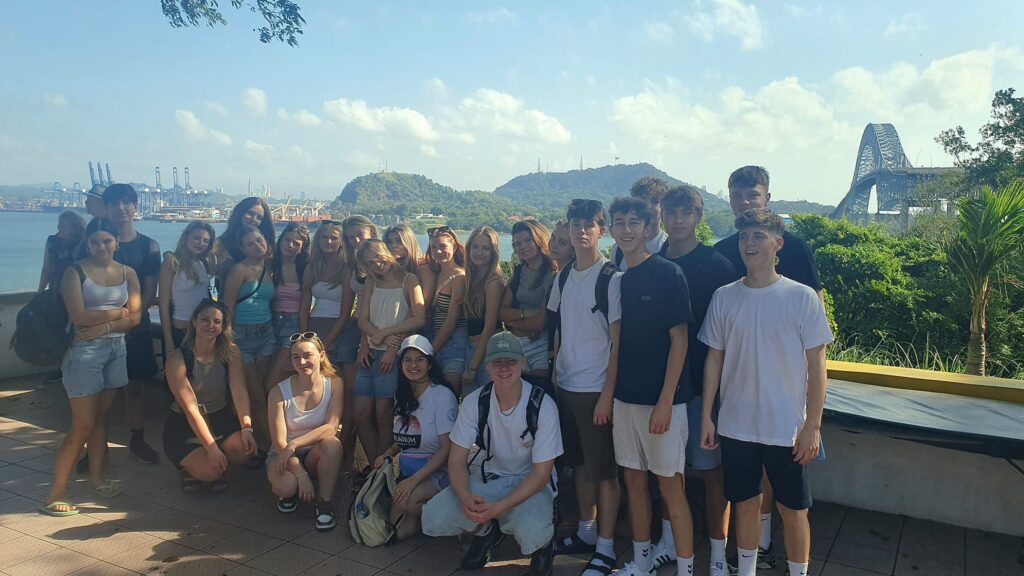 After-school students gathered with mountains in the background