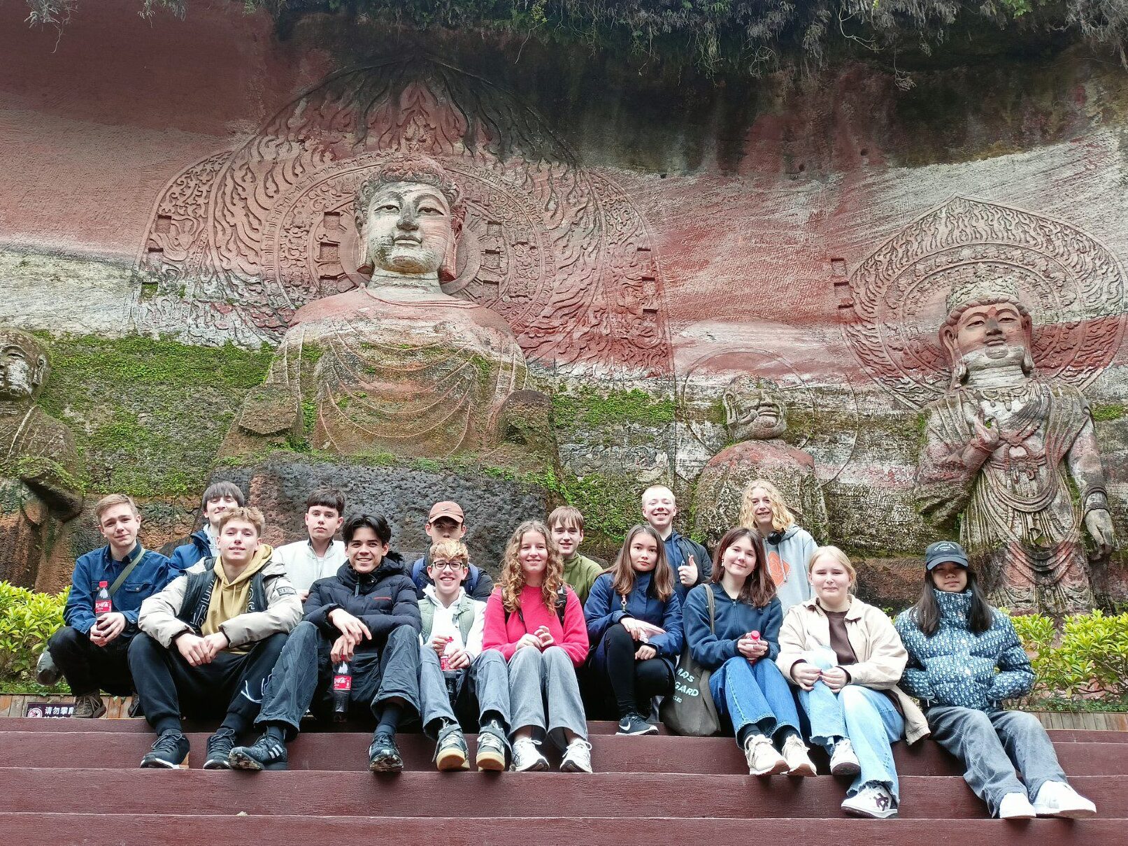 Students gathered in front of the budda