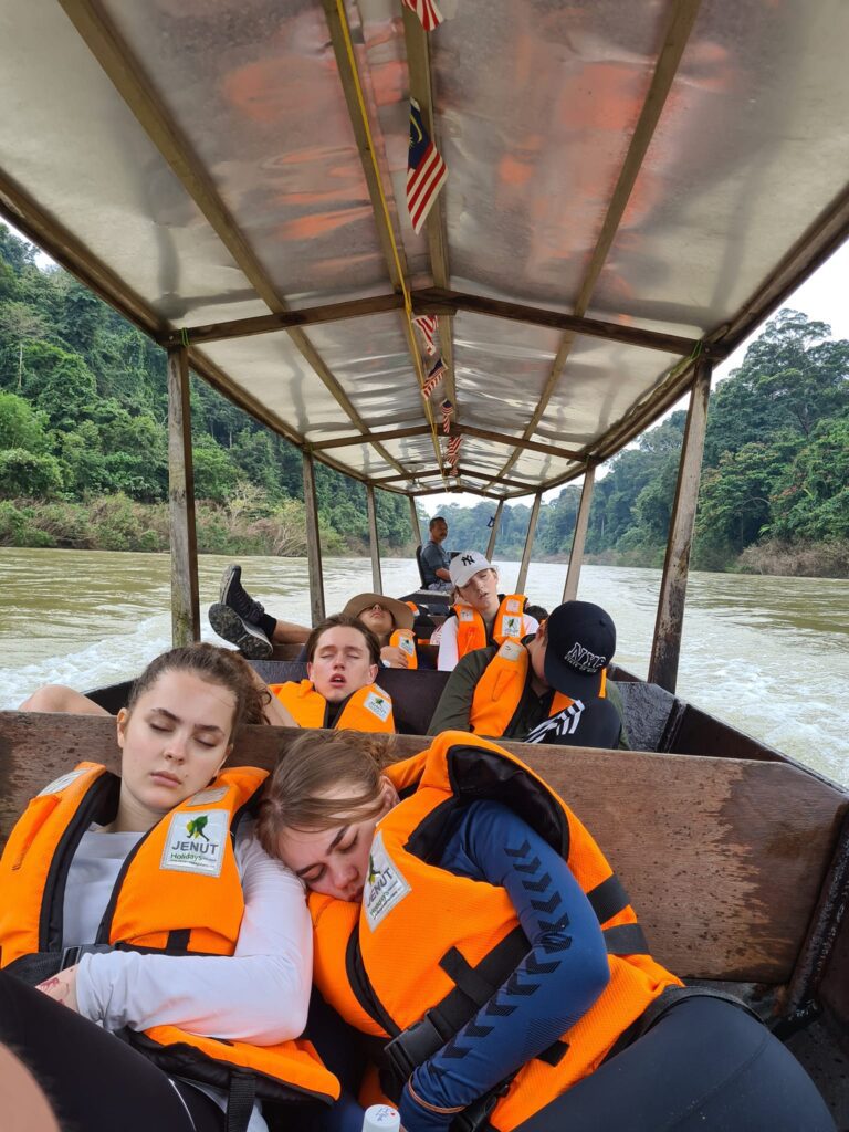 After-school students have fallen asleep on a boat in Malaysia