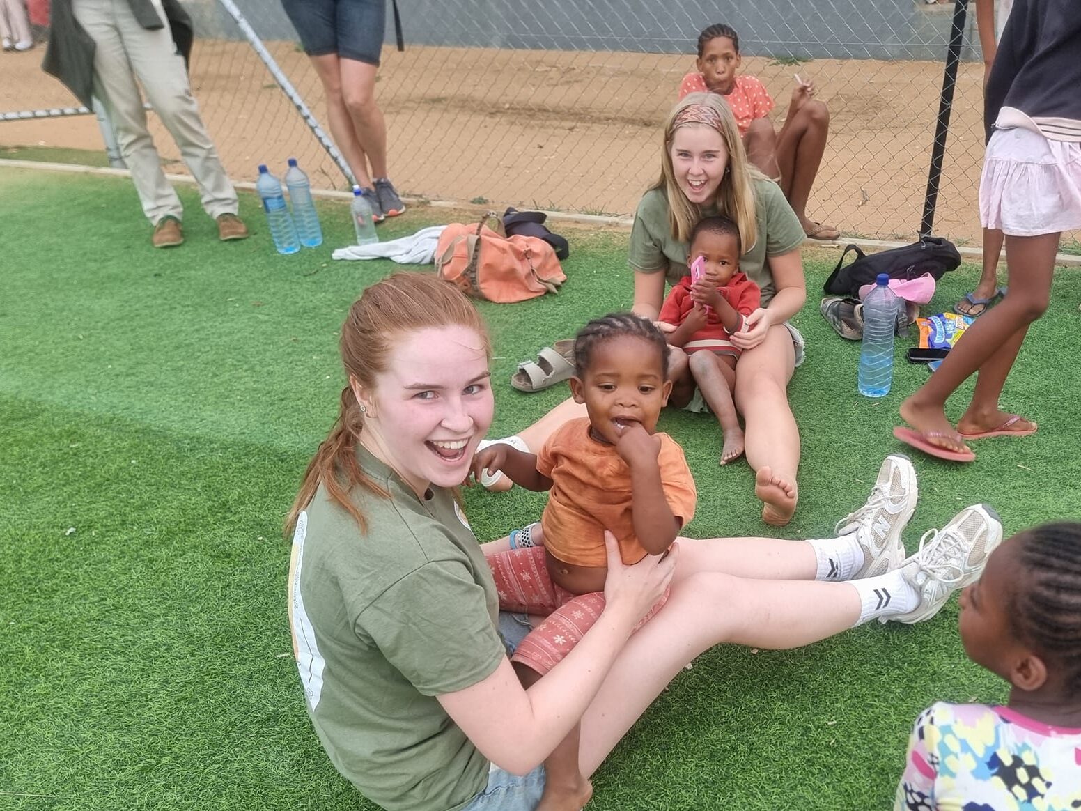 Two Danish girls play with two children from Namibia