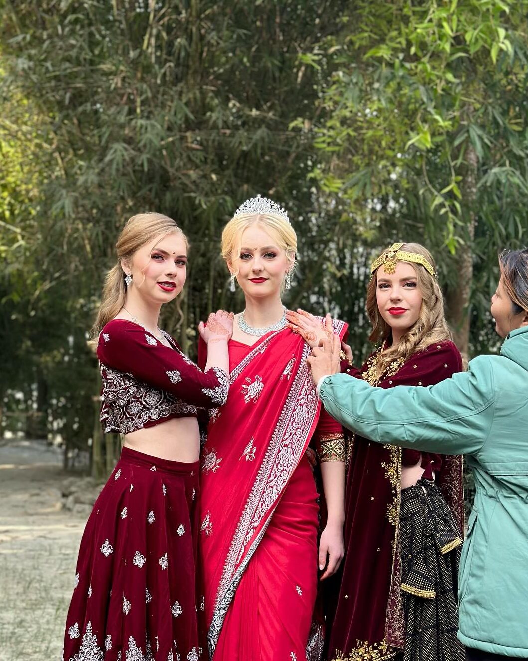 Three girls wearing dresses from Nepal's culture