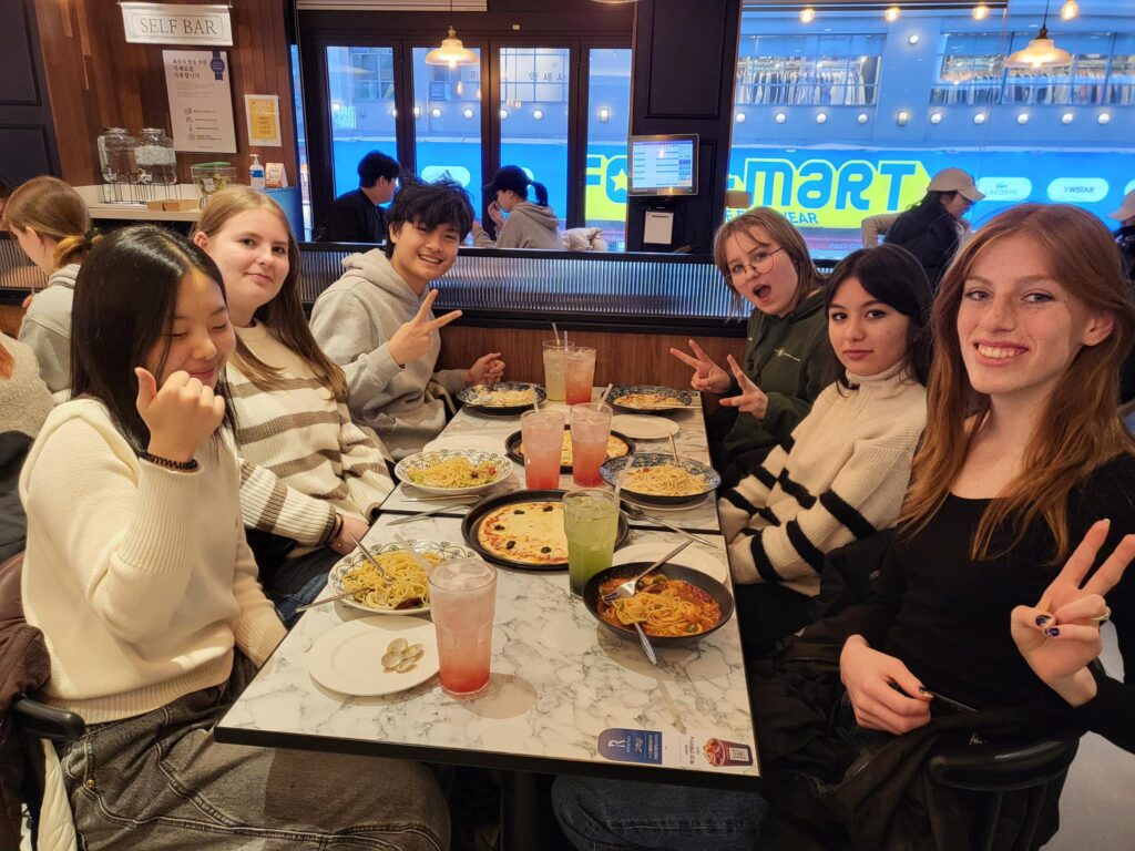 1TP5Students sitting down to dinner