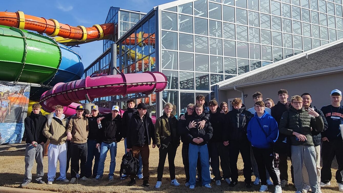 After-school students gathered in front of water slides 