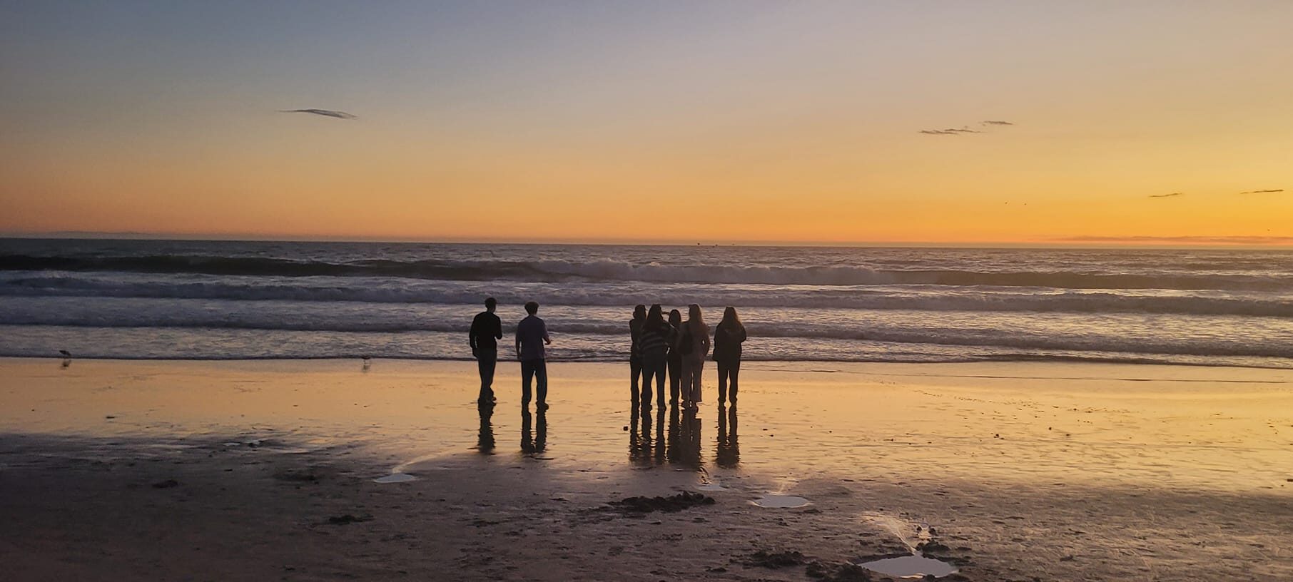 Students gather at the stand and watch the sunset