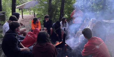 Screenshot 2025-02-25 at 20.41.22 Ranum Efterskole students grilling over a campfire